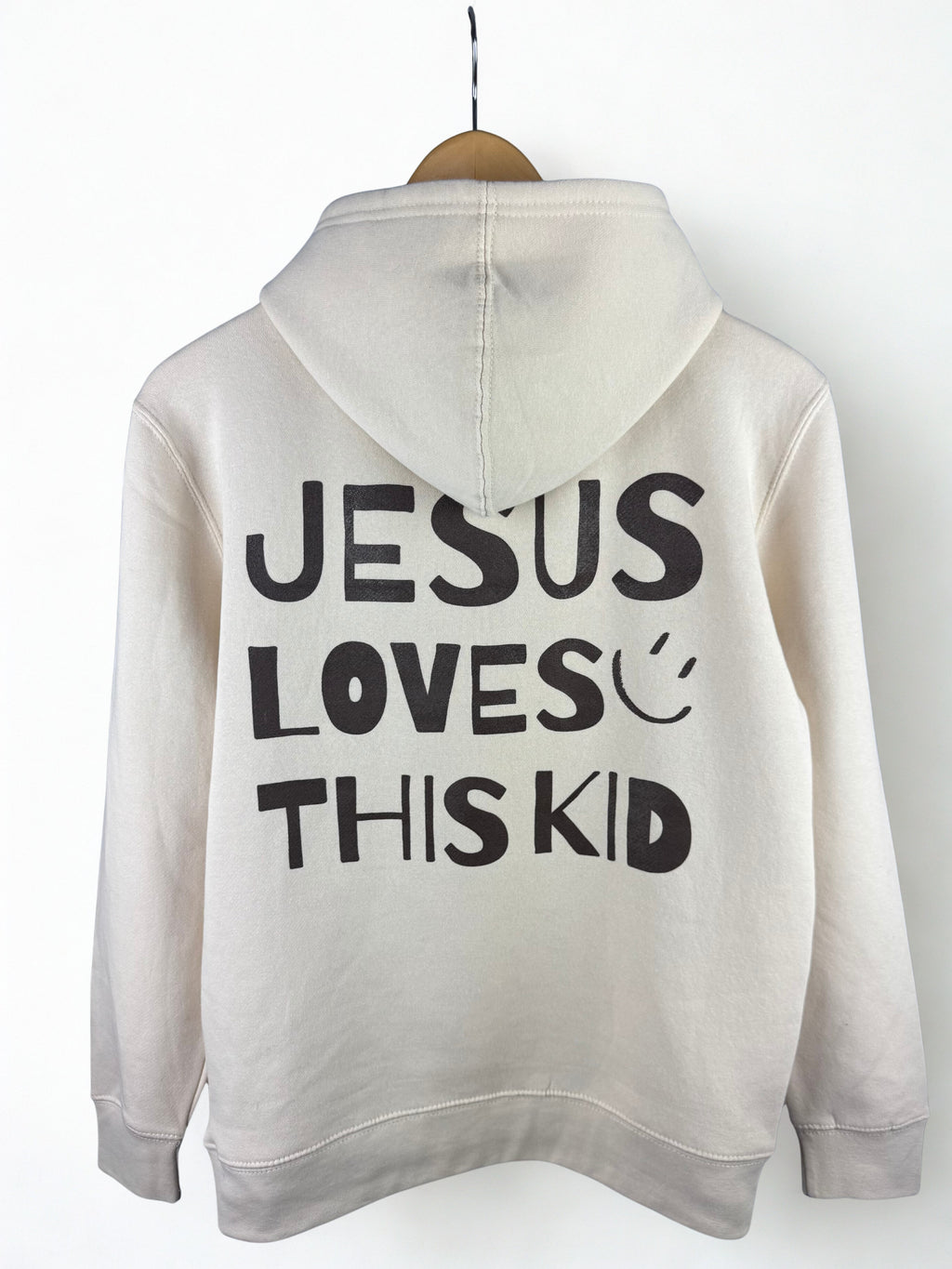 Cream hoodie with 'Jesus Loves This Kid' in Chocolate Brown text 