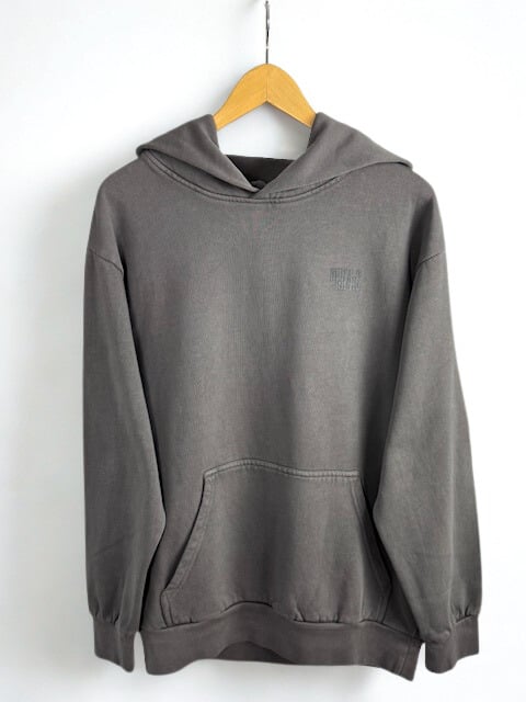Gray hoodie with PHIL4:6 text on a wooden hanger against a white background
