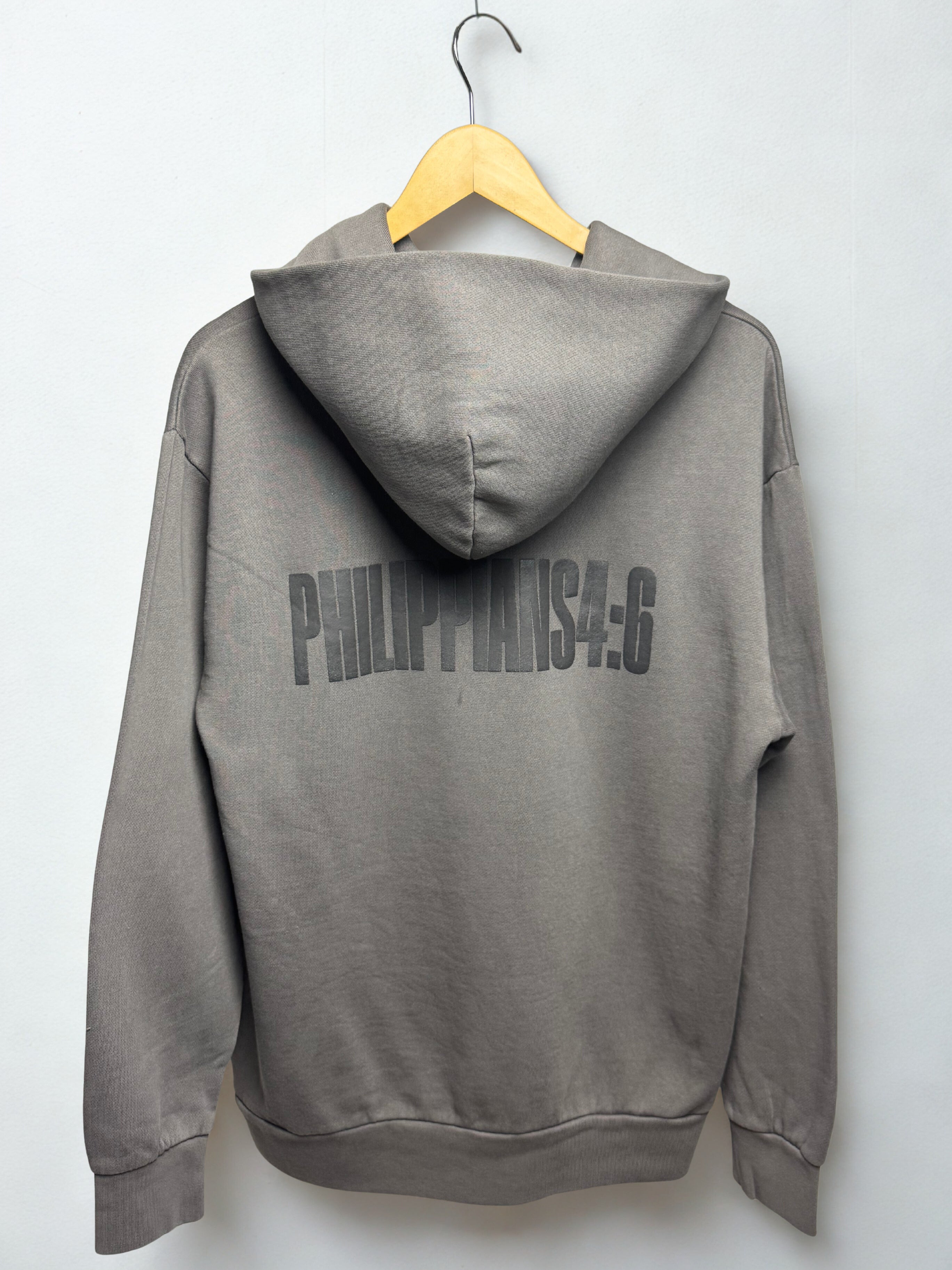 Gray hoodie with 'PHILIPPIANS 4:6' text on a white background